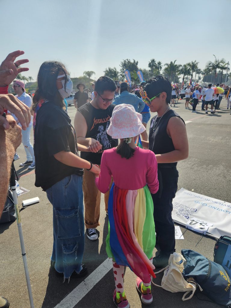 Picture of a prayer circle with FCC members and the community.